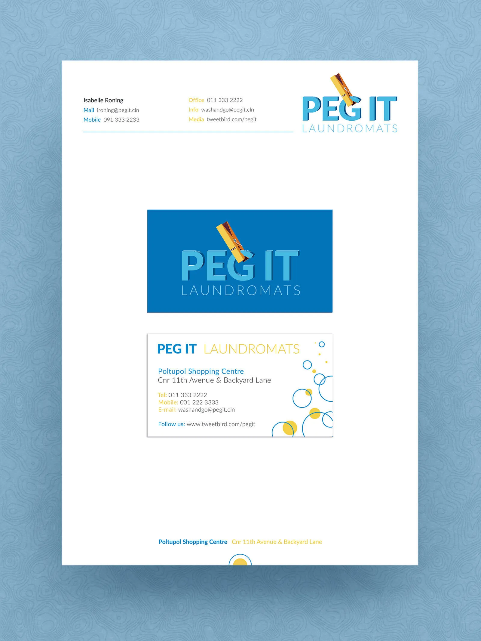 The Peg It letterhead with both cards laid on it. The mark sits top right above two columns of contact details ruled off with a blue line, the blue card centred on the sheet, and the address running across the foot.